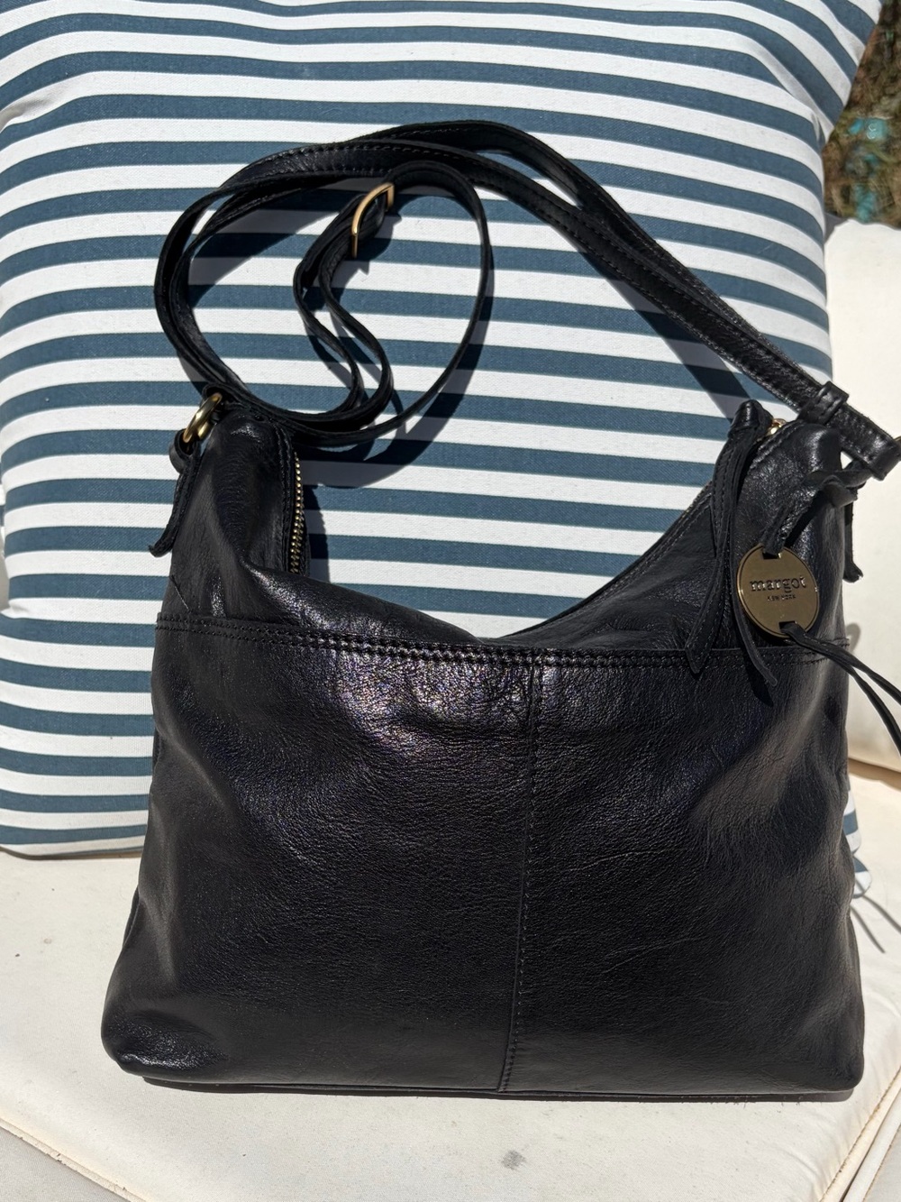 Margot of New York black leather hobo bag with adjustable strap.